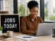 Jobs today featured image showing a professional South African job seeker working on a laptop in a modern office