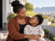 South African birth rate decline: mother sharing a warm moment with her child.